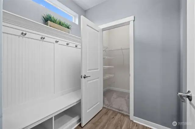 Mud Room from the garage to the Kitchen. The space offer the built-in coat and shoe area PLUS a walk-in additional closet!