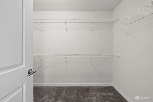 Primary Walk-in Closet - wraps around the corner.