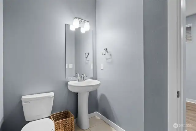 The Powder Room is a generous size right off the Foyer tucked away from the living room!