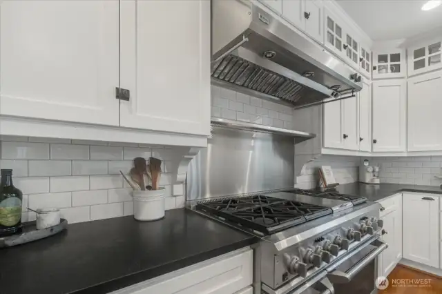 Kitchen features stainless steel appliances.