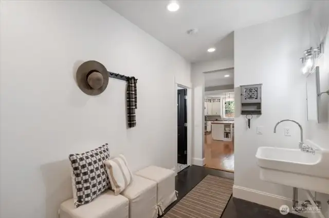 Mudroom with gorgeous large farmhouse sink.