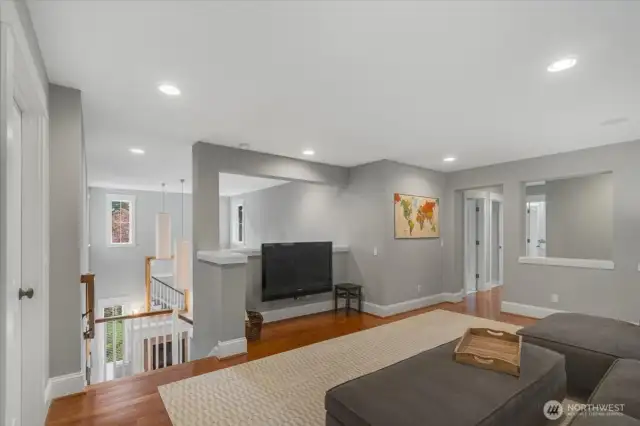 Large Loft/Rec room features hardwood floors.