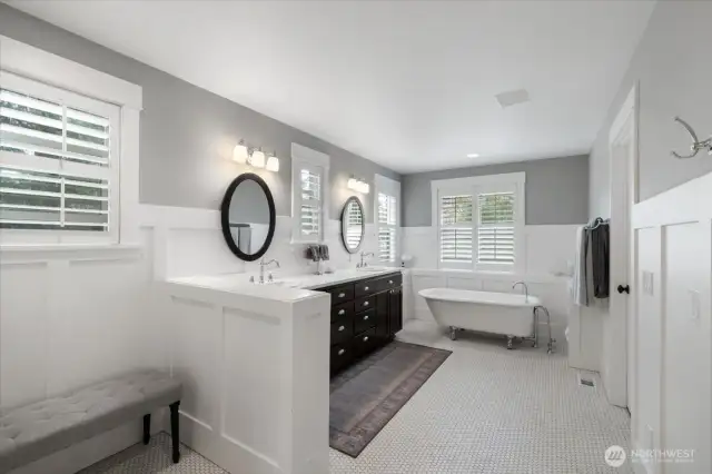 Primary Bath features victorian tub and enclosed water closet.
