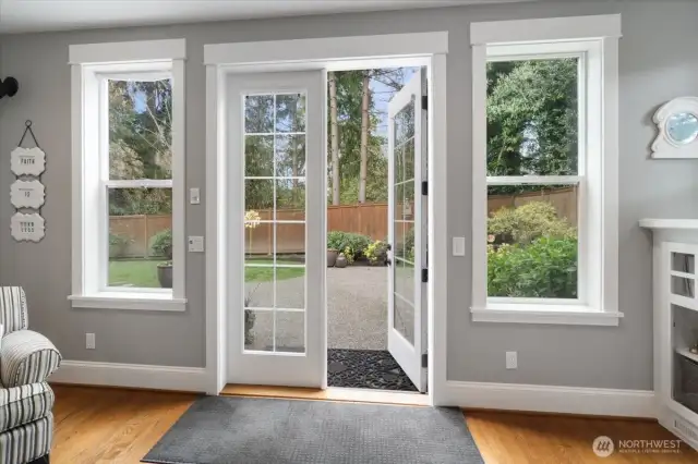 French doors lead to side yard.