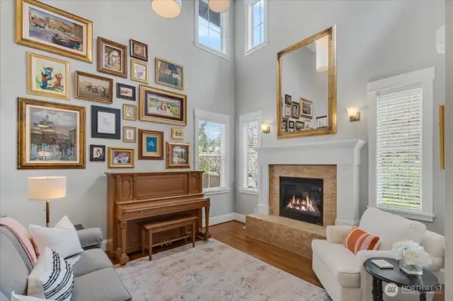 Living room also features gas fireplace and vaulted ceiling.