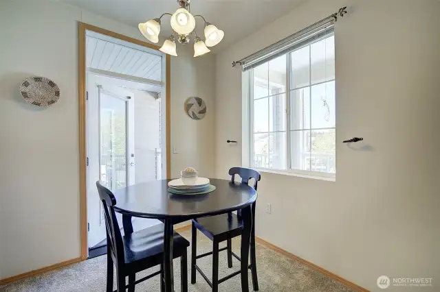 Eating space in kitchen leads out onto private deck which can also be accessed by the Primary bedroom.