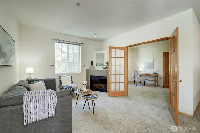 Living room with corner fireplace is cozy and relaxing.