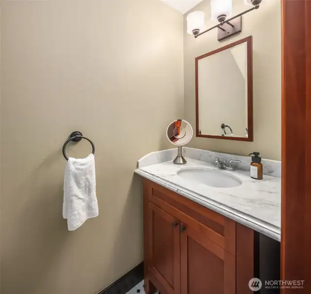 Main level half bathroom.