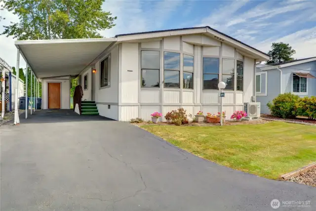 Welcome home! Expansive driveway with storage shed!