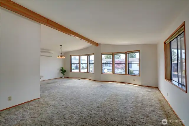 Freshly painted interior - spacious living room with abundant light, AC and easy access to the kitchen