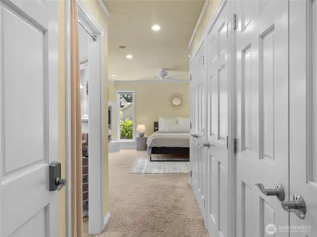 Wall of closets as you enter the primary