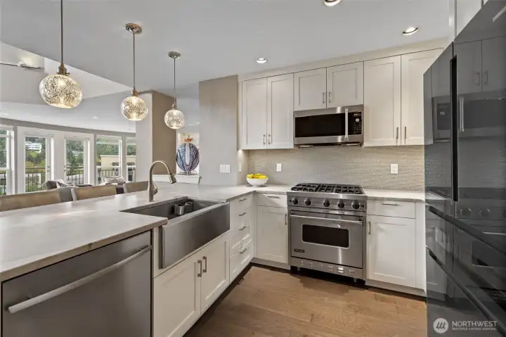 Well appointed kitchen with newer Bosch refrigerator.