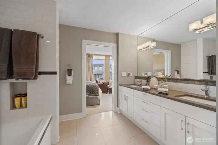 5 piece bath with marble counters and heated floors.