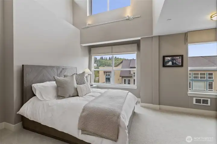 Guest room with vaulted ceiling and a walk-in closet.