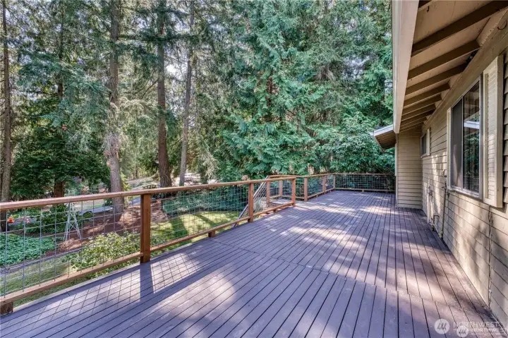 Large deck with recently updated railing and stairs.