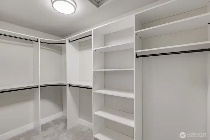 One of two large walk-in closets in the Primary.  Both are complete with an organizing closet system.