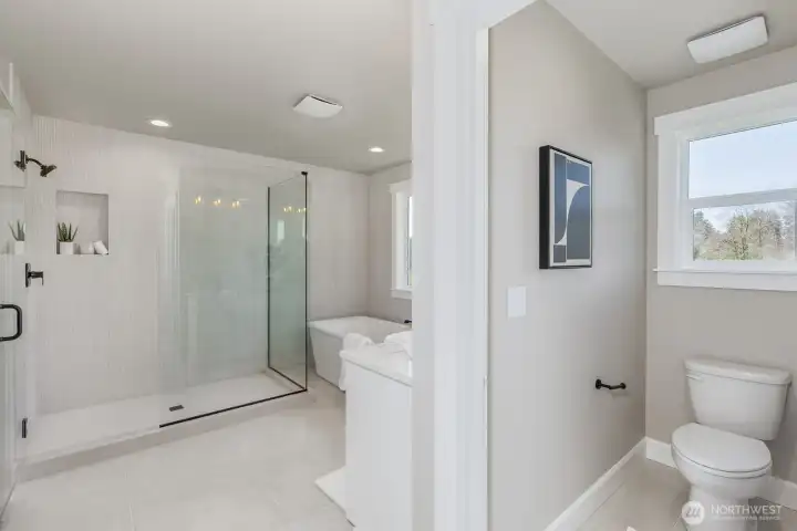 Primary bathroom features extensive tile detail.