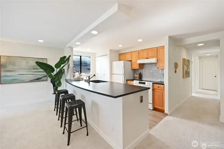 Beautifully renovated open kitchen with exceptional material choices.