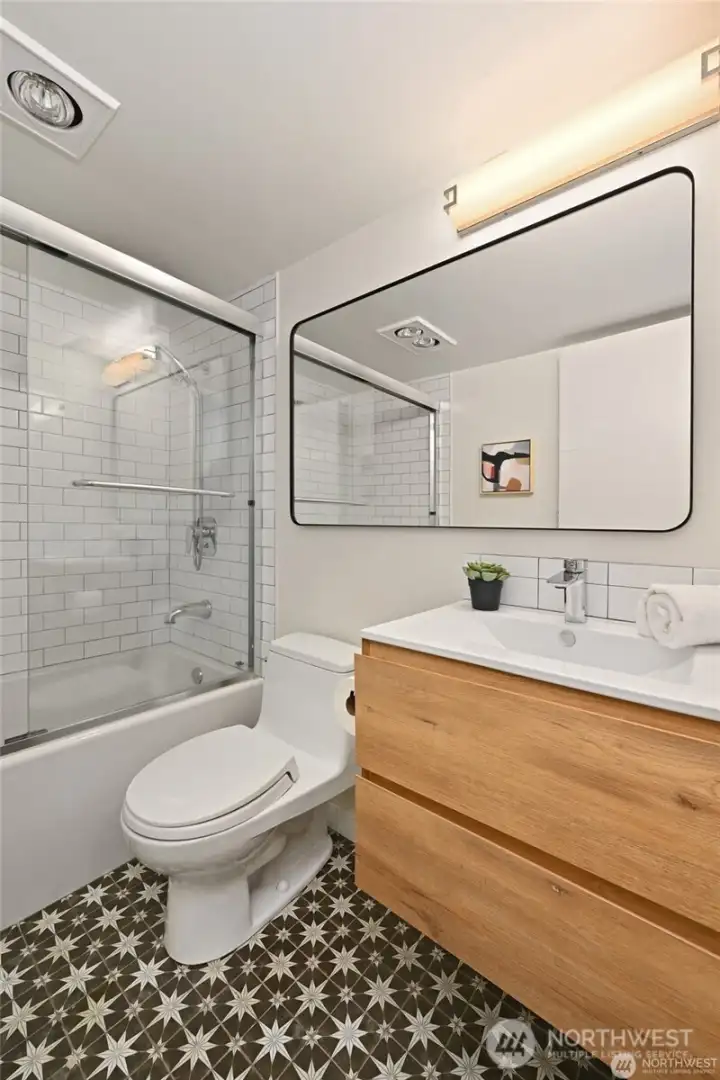 Beautiful tile flooring in the renovated bath