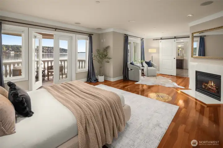 Relaxing primary suite with fireplace and private balcony.