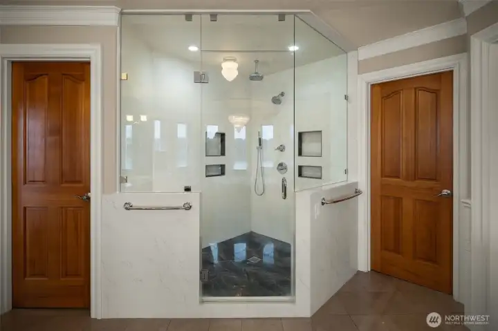 Primary bath Luxury glass enclosed walk-in shower.