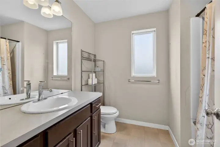 Beautifully appointed 3rd floor hallway full bathroom with modern vanity and quality fixtures