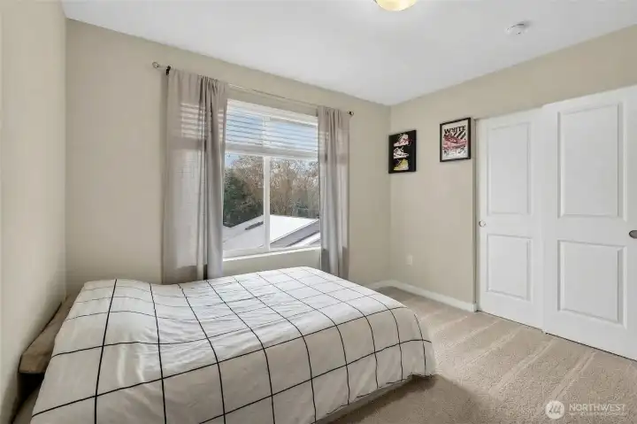 Refined 3rd floor bedroom with stylish accents, ample space, and a calm, welcoming ambiance