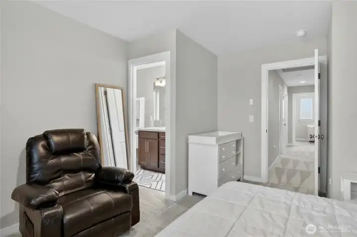 Master suite bedroom with walk-in closet, plush finishes, and a peaceful, sun-drenched layout