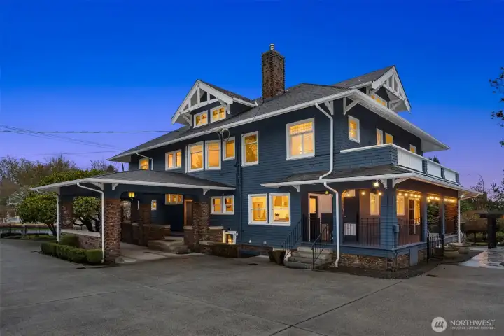 Architectural depth and craftsmanship unfold from every angle. Expansive porches, dormered rooflines, and rich shingle siding highlight the scale and versatility of this historic estate, thoughtfully designed for both grand entertaining and everyday living.