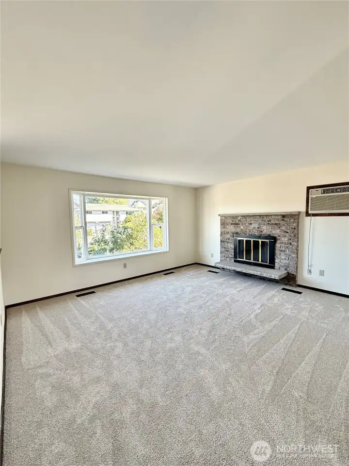 Wood burning fireplace in main floor living room