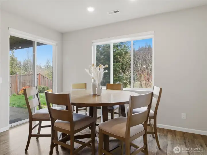 Designated dining space right off the kitchen with easy access to the patio!