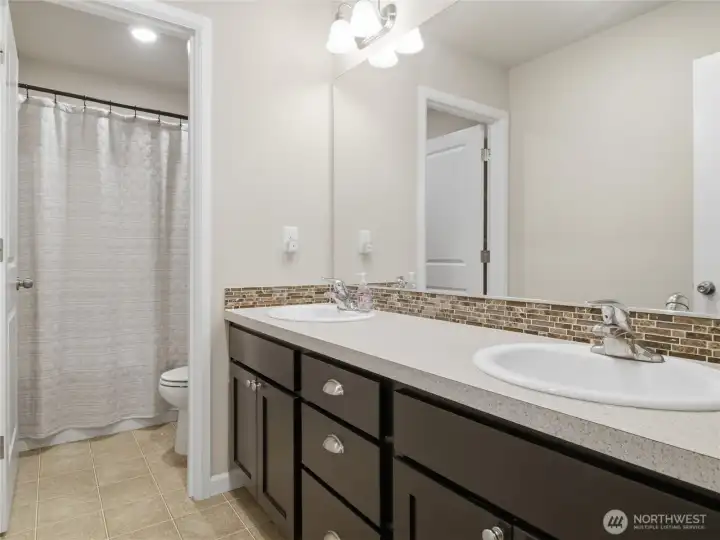 Upstairs full bathroom, with privacy door- separating sinks