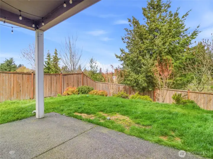 Enjoy evenings sitting on the covered porch with no neighbors behind you