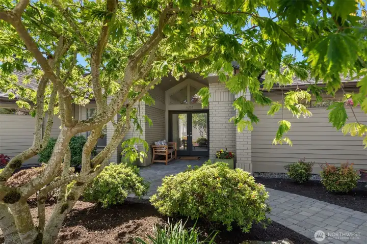Home is framed by beautiful landscaping