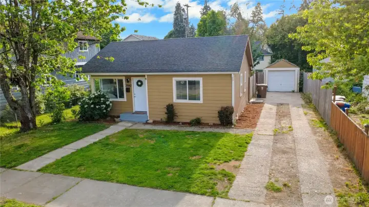 This home is the only one nearby that has a driveway off of the street. Most of the homes only have alley access to their garage.