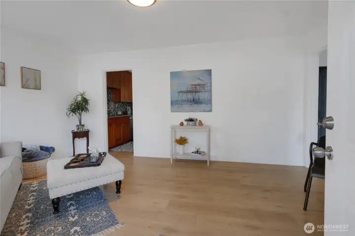 As you enter the living room you will see the kitchen through the door on the left. The 2 bedrooms & full bath are over to the right.