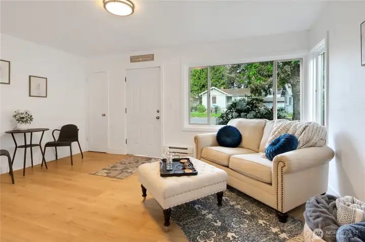 Fresh new paint, new flooring, baseboards and wall heaters.