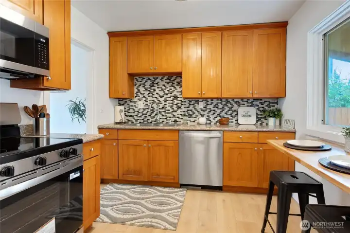 The kitchen has cherry cabinets & Granite Counters.