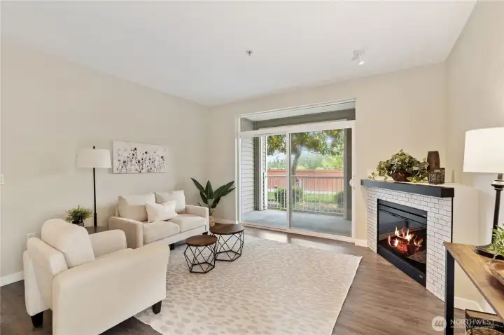 Generously sized family room has sliding glass door to covered back porch overlooking valley. Generously sized family room has sliding glass door to covered back porch overlooking valley.