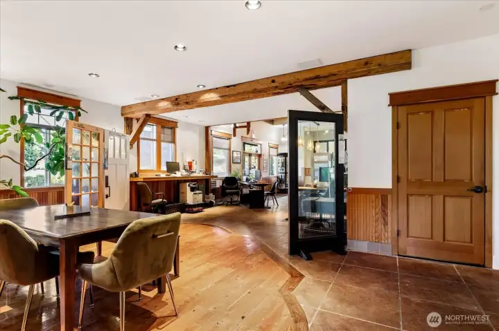 These hardwood floors are 100+ years old, and in excellent condition.  The closed fir door is one of the 4 bathrooms.  This building is an inspiring place to work, and to do business!