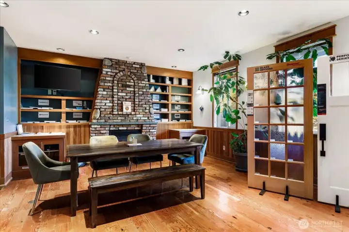 The attention to details in design/build of this building are timeless.  Floor to ceiling brick fireplace is propane.  Ceilings are 12' here.  This is a wonderful large office space, or showroom/meeting space.