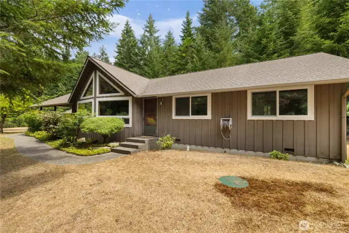 Beautiful and private 1 story home with A frame windows.