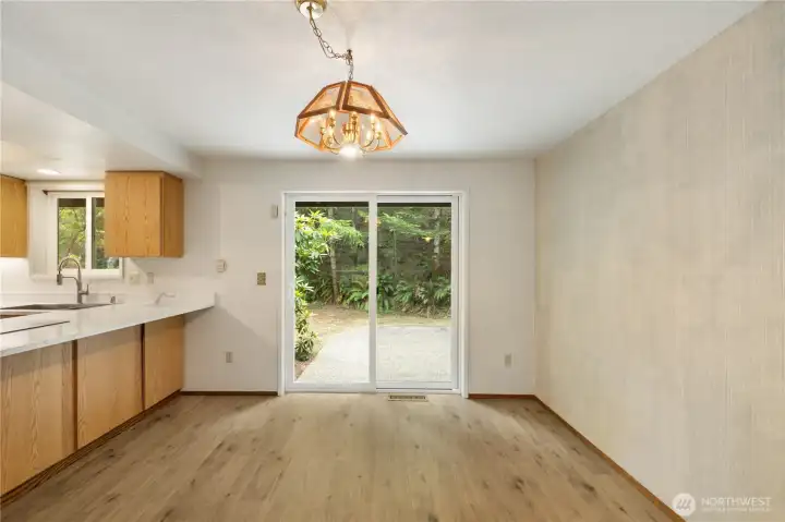 Plenty of room for your dining table and sliding doors lead to the back patio.