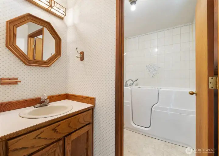 Primary walk in jetted tub is excellent for convenience and comfort.