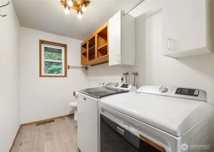Laundry room includes a half bath.