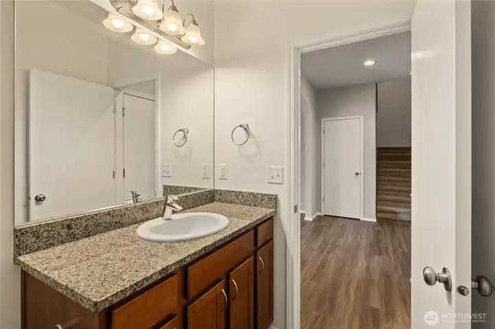 Granite countertop in hallway 1/2 bath.