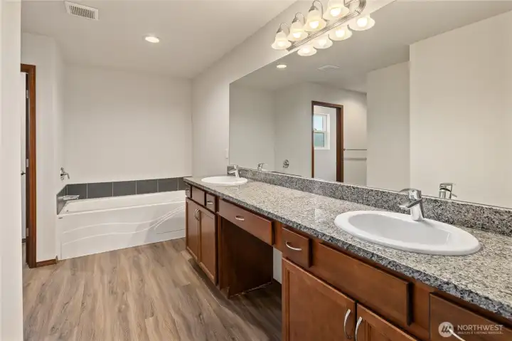Primary Bathroom with granite counters and dual sinks!