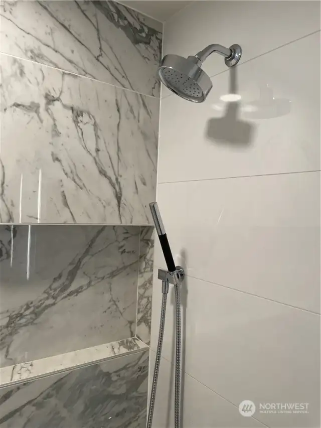 Double Shower heads and built in storage nook