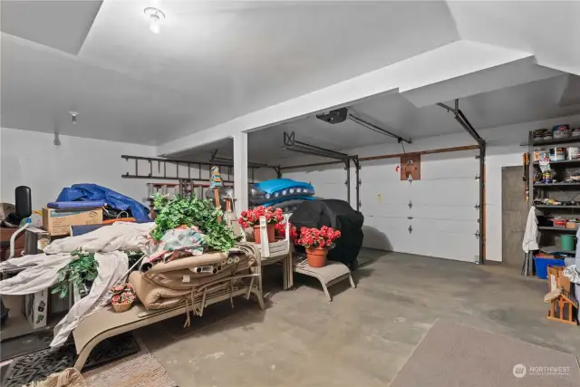 This is a 2 car garage, but the space to the right goes way farther than the photo depicts and is a great shop or extra storage space