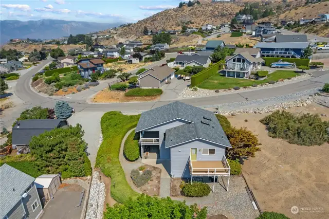 Plenty of space for a garden, this yard has a automatic sprinkler system